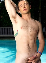 Dan strokes his huge cock by the pool by Randy Blue