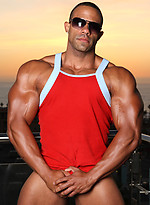 Muscled latino Rico posing on a balcony by Manifest Men