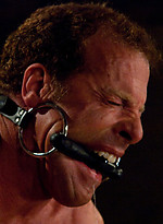 Three doms use and abuse Derek Pain during a live shoot. by Bound Gods