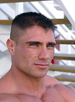 Antonio posing outdoors by Muscle Gallery