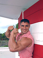 Antonio posing outdoors by Muscle Gallery