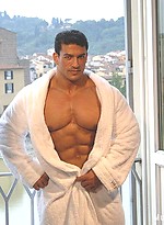 Tarek posing outdoors by Muscle Gallery
