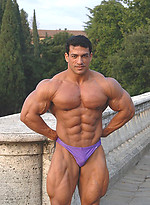 Tarek posing outdoors by Muscle Gallery