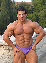 Tarek posing outdoors by Muscle Gallery