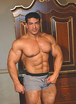Tarek posing outdoors by Muscle Gallery