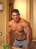 Tarek posing outdoors by Muscle Gallery