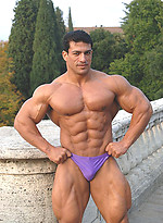 Tarek posing outdoors by Muscle Gallery