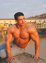 Tarek posing outdoors by Muscle Gallery