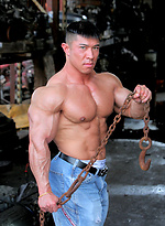 Muscled asian man Daryl Gee posing by Muscle Gallery