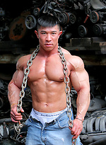 Muscled asian man Daryl Gee posing by Muscle Gallery