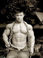 Muscled asian man Daryl Gee posing by Muscle Gallery