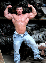 Muscled asian man Daryl Gee posing by Muscle Gallery