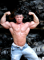 Muscled asian man Daryl Gee posing by Muscle Gallery