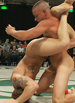Four big dicked muscle studs fight it out to win the right to humiliate and fuck the losers in front of a live crowd in this brutal tag team match. by Naked Kombat