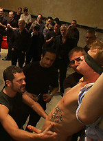 A stud endures brutal face and ass fucking by a crowd of strangers while suspended upside down. by Bound in Public