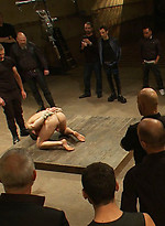 A stud endures brutal face and ass fucking by a crowd of strangers while suspended upside down. by Bound in Public