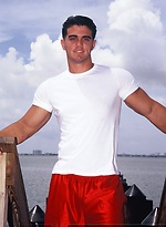 Young jock Alain Lamas by the water by Mark Wolff