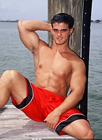 Young jock Alain Lamas by the water by Mark Wolff