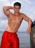 Young jock Alain Lamas by the water by Mark Wolff
