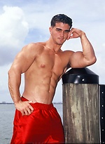 Young jock Alain Lamas by the water by Mark Wolff