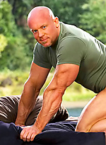 Bald muscle man Luke Garrett naked by Colt Studio