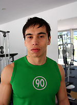 Young jock shows his sixpack in a gym by Bentley Race