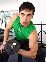 Young jock shows his sixpack in a gym by Bentley Race