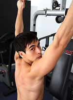 Young jock shows his sixpack in a gym by Bentley Race