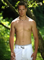 Cute boy posing naked outdoors by William Higgins