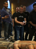 Blindfolded stud sucks strangers cocks at a party. by Bound in Public