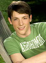 Cute twink posing on a lawn by Colt Studio