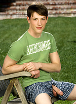 Cute twink posing on a lawn by Colt Studio