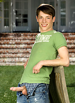 Cute twink posing on a lawn by Colt Studio