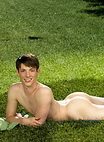 Cute twink posing on a lawn by Colt Studio