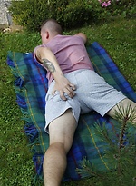 Joshua Czech lays a blanket down outside and busts a nut. by BF Collection