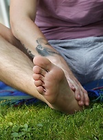 Joshua Czech lays a blanket down outside and busts a nut. by BF Collection