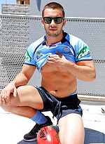 James Nowak strips out of his rugby gear on the roof by Bentley Race
