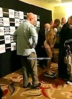 The heavily tattooed tough guy demurely stands on the scales covering his cock and balls by Ruggerbugger