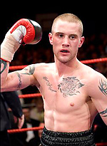 The heavily tattooed tough guy demurely stands on the scales covering his cock and balls by Ruggerbugger