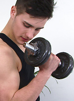 Young guy picks up a dumbbell by English Lads