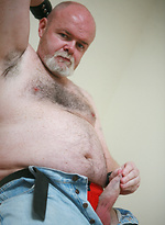 Fat & old David McNamara posing by Pantheon Bear