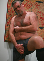Daddy in suit posing by Pantheon Bear