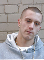 Shaved-headed stud Nick shows his inked body while masturbating on the bed by Nextdoor Buddies