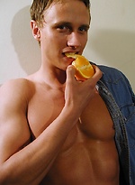 Michael Davids squeezes orange juice all over ripped body. by BF Collection
