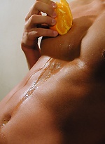 Michael Davids squeezes orange juice all over ripped body. by BF Collection