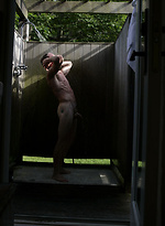 Parker posing outdoors by Playgirl