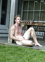 Parker posing outdoors by Playgirl