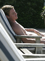 Parker posing outdoors by Playgirl