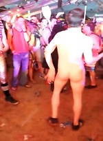 Dude totally off his face is having the time of his life stripped down and the centre of attention while everyone watches. by Eric Deman